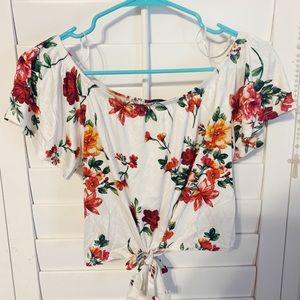 This is a white and floral off the shoulder top.